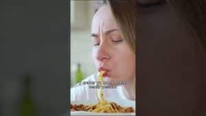 1786167417_maxresdefaultjpg - Affiliated Shops Woman eating spaghetti with sauce, eyes closed, plate of pasta in view.